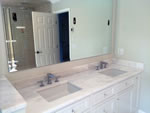 Bath Remodels:  Wall sconces installed through mirrors